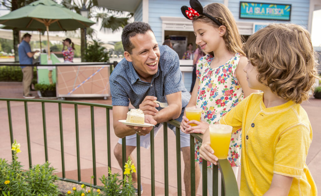 dad and kids eating dole whip image