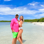 Couple on honeymoon at Seven Mile Beach in Negril featuring pristine white sand, turquoise Caribbean waters, and romantic oceanfront views