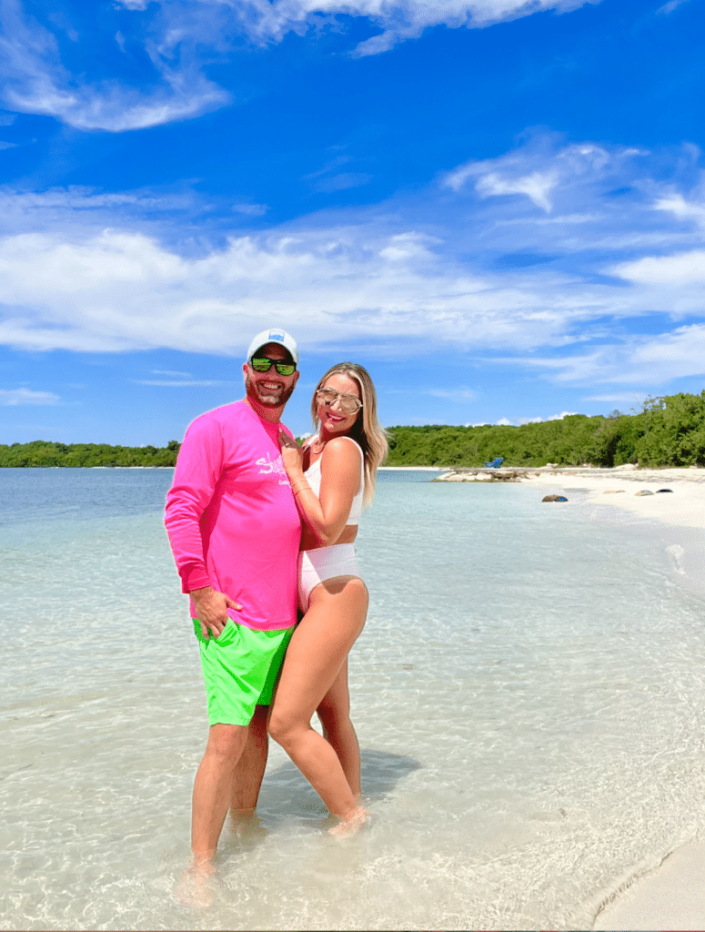 Couple on honeymoon at Seven Mile Beach in Negril featuring pristine white sand, turquoise Caribbean waters, and romantic oceanfront views