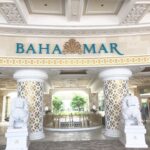 Entrance to the Grand Hyatt Baha Mar in Nassau, Bahamas with elegant pillars, lion statues, and a view into the resort’s lobby.