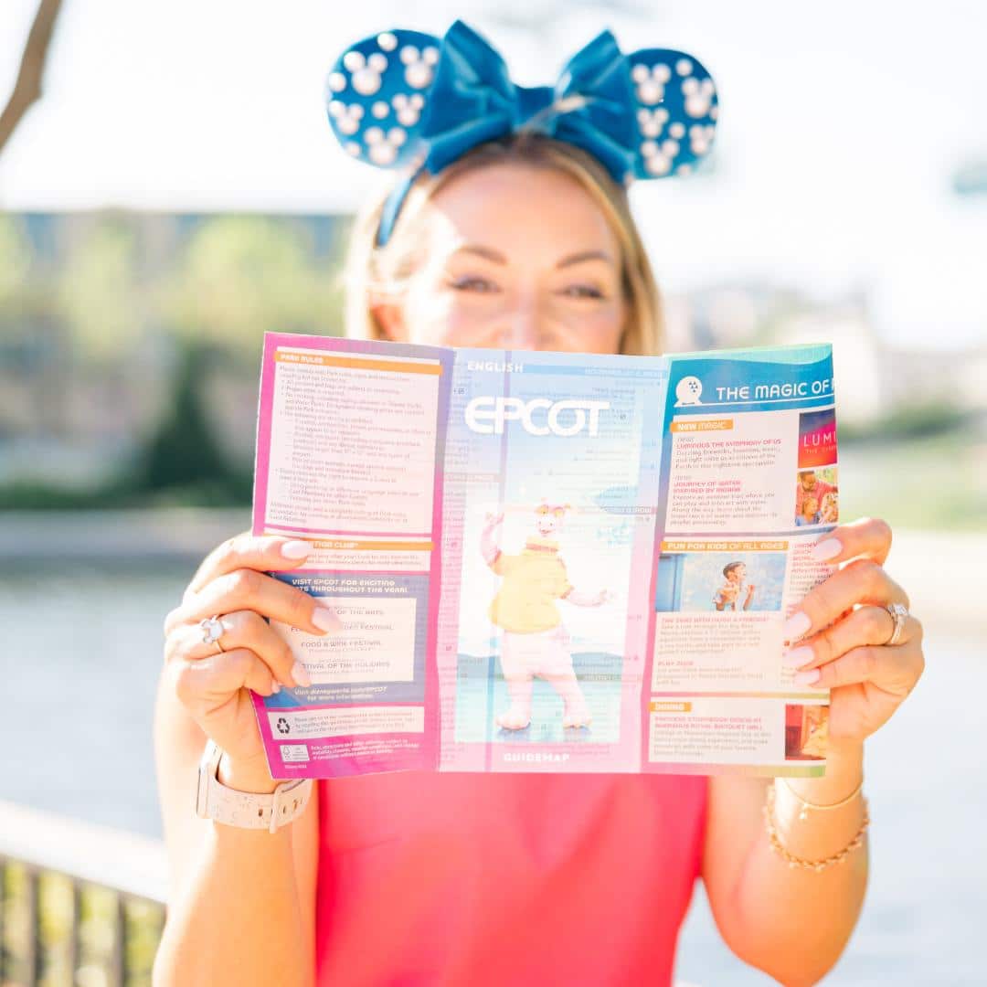 Guest looking at park map in EPCOT at Walt Disney World planning park day