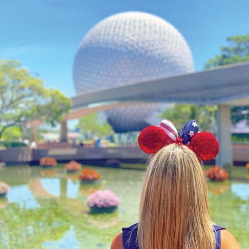 EPCOT at Walt Disney World showcasing iconic Spaceship Earth with scenic walkways and vibrant landscaping, captured during a Traveling Ears Vacations Disney travel experience