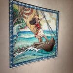 Colorful mosaic tile artwork of Moana sailing her canoe, displayed on the Disney Treasure cruise ship.