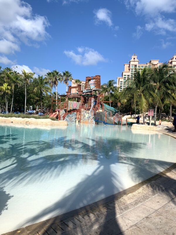 Family-friendly water park at Atlantis Bahamas on Paradise Island Colorful water playground at Atlantis Bahamas Aquaventure water park on Paradise Island, with palm trees, clear blue skies, and a pristine pool that’s perfect for kids and families.