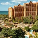 Aulani, A Disney Resort & Spa in Ko Olina, Oahu, featuring ocean views, lush tropical gardens, and a lagoon-style pool area.