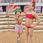 kids enjoying disney cruise pool deck during the holidays