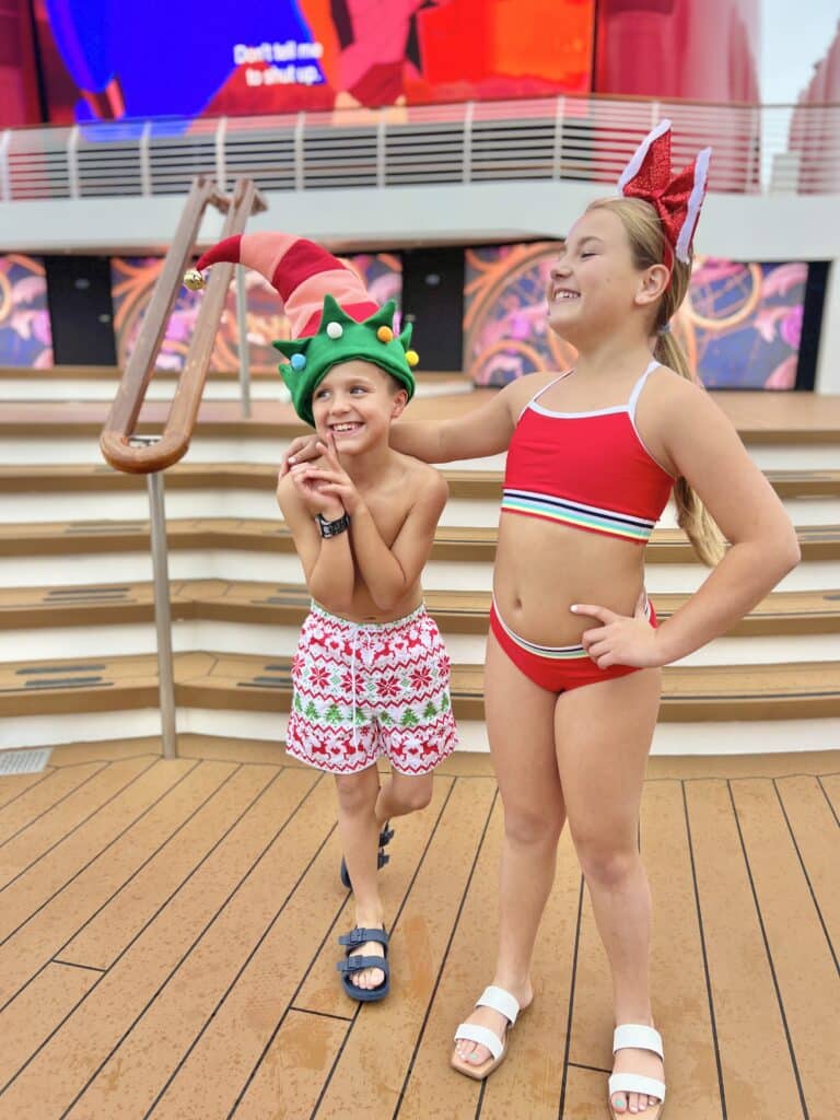 kids enjoying disney cruise pool deck during the holidays