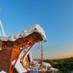 Water slide with snowy landscape backdrop