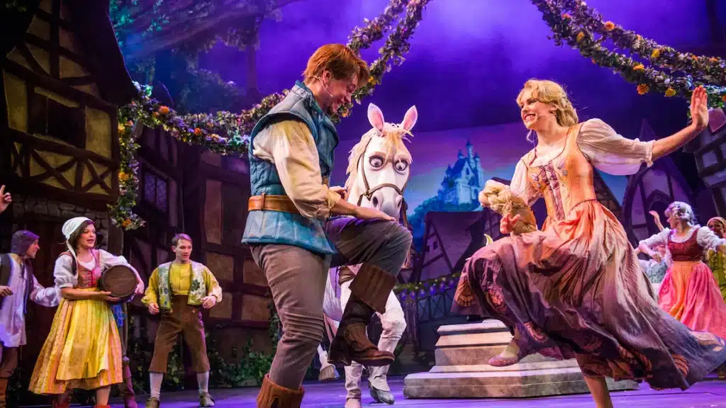 Tangled Broadway-style show on Disney Cruise Line featuring Rapunzel and Flynn Rider on stage