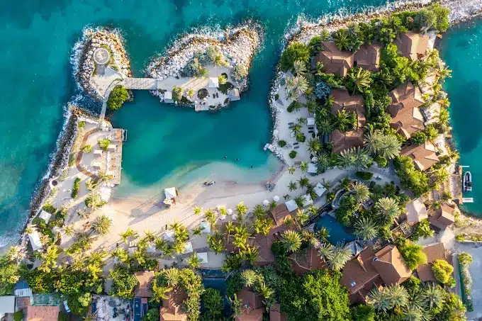 Tropical resort with sandy beach and water Baoase Luxury Resort ariel photo