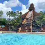 Disney’s Coronado Springs Resort pool featuring the Lost City of Cibola at the Dig Site, a Mayan pyramid centerpiece with cascading water, a 123-foot jaguar waterslide, the largest hot tub at Walt Disney World, and additional quiet leisure pools surrounded by lush tropical landscaping