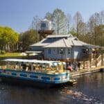 Disney’s Port Orleans Riverside Resort at Walt Disney World featuring Southern plantation-style mansions and rustic bayou cottages, scenic Sassagoula River views, peaceful walking paths, and the Ol’ Man Island pool with a water wheel and lush landscaping
