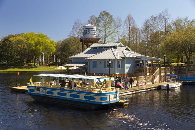 Disney’s Port Orleans Riverside Resort at Walt Disney World featuring Southern plantation-style mansions and rustic bayou cottages, scenic Sassagoula River views, peaceful walking paths, and the Ol’ Man Island pool with a water wheel and lush landscaping