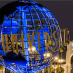 Universal Studios Hollywood theme park featuring the iconic globe entrance, the Wizarding World of Harry Potter, the famous Studio Tour backlot experience, and immersive movie-themed rides in Los Angeles California