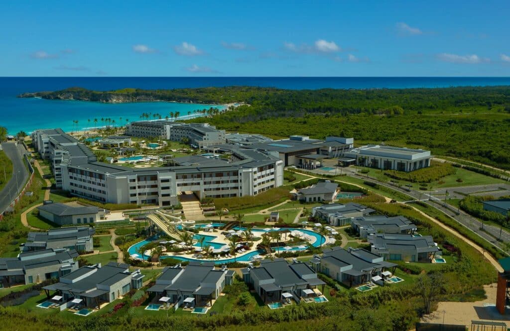 Aerial view of Dreams Macao Beach Punta Cana with resort buildings, pools and water features