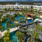 Elevated view of the water park, pools and resort buildings at Dreams Onyx Punta Cana