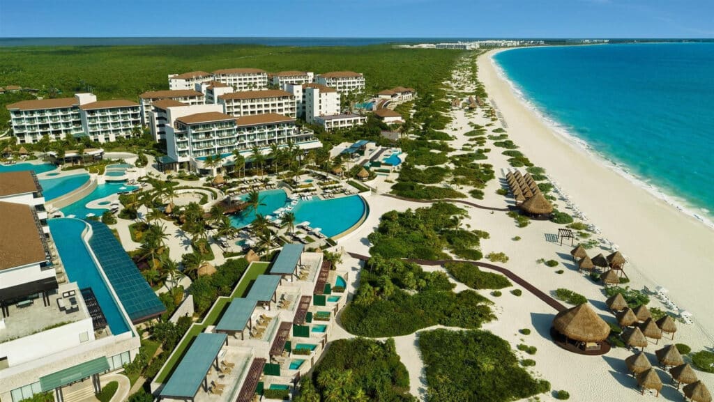 Aerial view of Dreams Playa Mujeres with resort pools, white-sand beach and turquoise Caribbean water in Playa Mujeres, Mexico