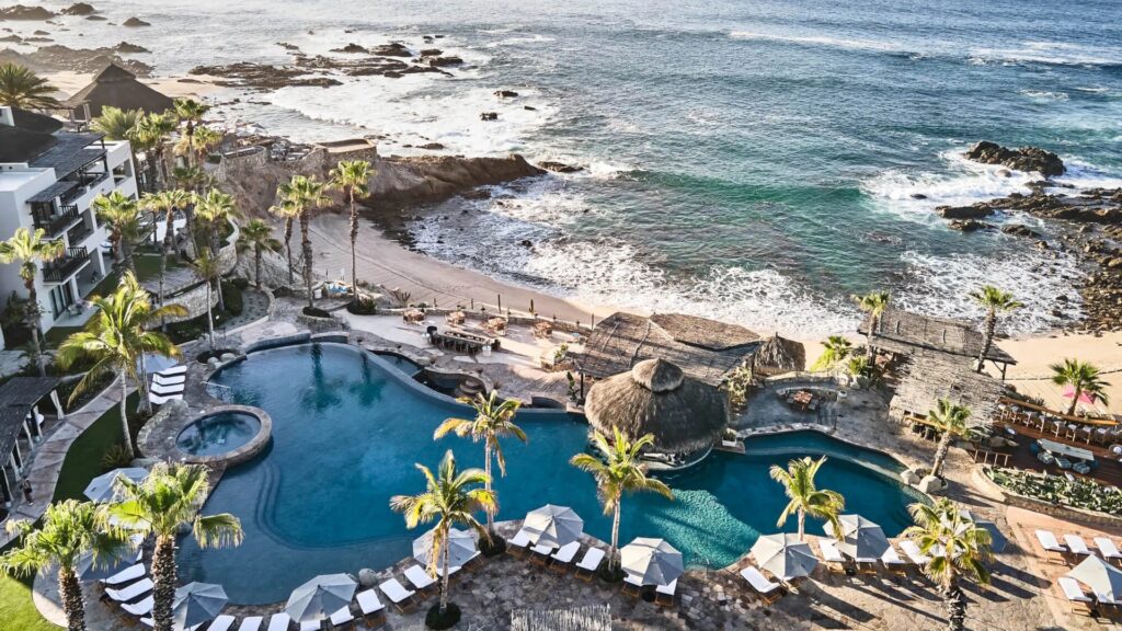 Oceanfront pool complex and rocky Sea of Cortez shoreline at Esperanza Auberge Collection in Los Cabos