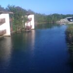 Fairmont Mayakoba casita buildings beside a lagoon and tropical mangroves in Riviera Maya
