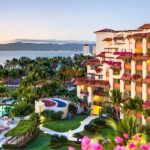 Panoramic view of Grand Velas Riviera Nayarit with pools, tropical gardens, resort buildings and Banderas Bay