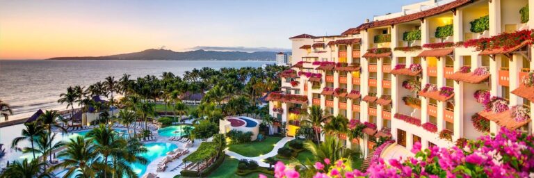Panoramic view of Grand Velas Riviera Nayarit with pools, tropical gardens, resort buildings and Banderas Bay