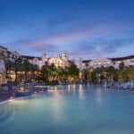 Twilight view of the large resort pool and hotel facade at Hard Rock Hotel at Universal Orlando