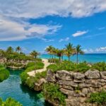 Natural river, tropical landscaping and Caribbean Sea at Hotel Xcaret Mexico in Riviera Maya