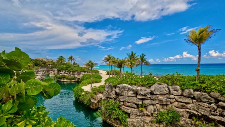 Natural river, tropical landscaping and Caribbean Sea at Hotel Xcaret Mexico in Riviera Maya