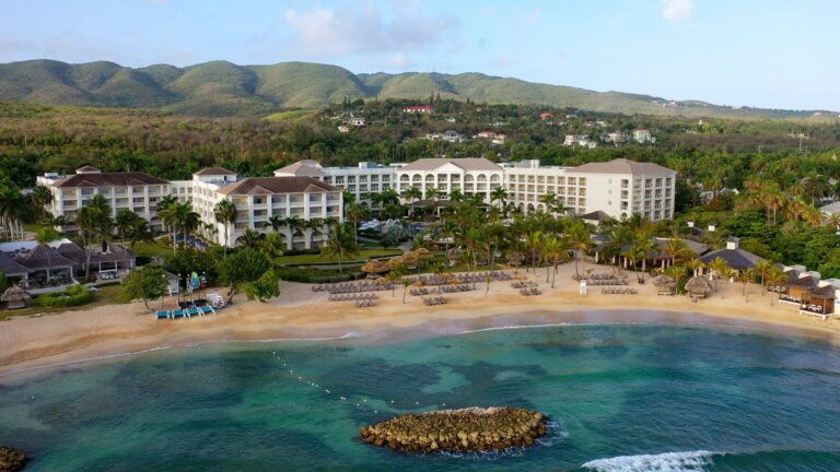 Aerial view of Hyatt Zilara Rose Hall with beachfront resort buildings and Caribbean water in Montego Bay Jamaica