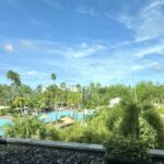 Tropical pool and palm-filled grounds at Loews Royal Pacific Resort in Universal Orlando
