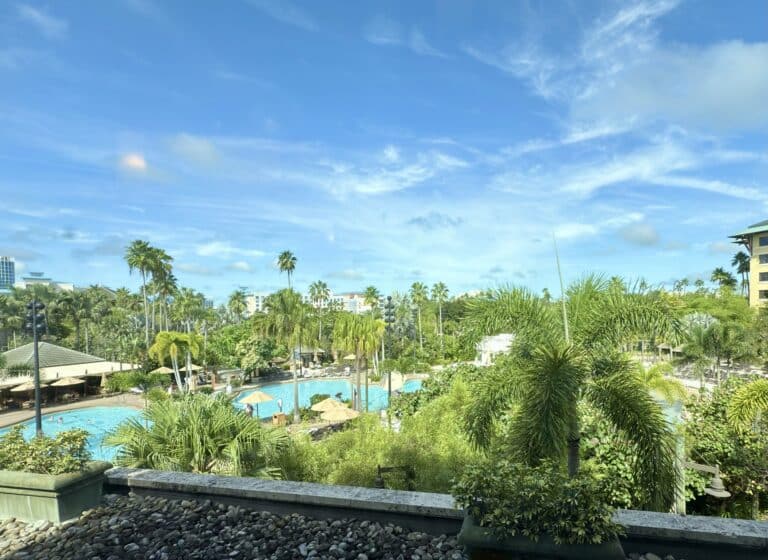 Tropical pool and palm-filled grounds at Loews Royal Pacific Resort in Universal Orlando