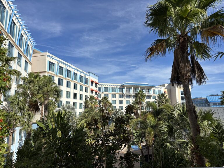 Blue-roofed guest buildings and tropical landscaping at Loews Sapphire Falls Resort in Universal Orlando