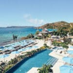 Infinity pool and waterfront beach club at Lovango Resort on its private island in the U.S. Virgin Islands