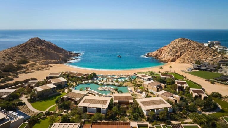 Aerial view of Montage Los Cabos with pools and resort buildings around Santa Maria Bay