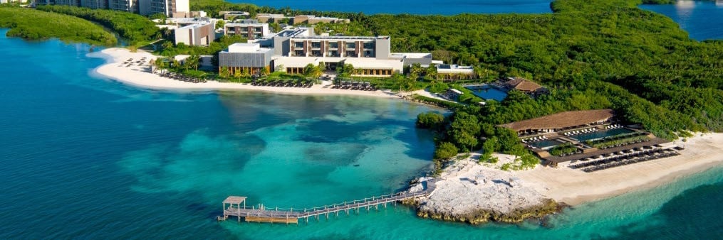 Aerial view of NIZUC Resort & Spa with secluded beaches, turquoise water and resort buildings in Punta Nizuc, Cancun