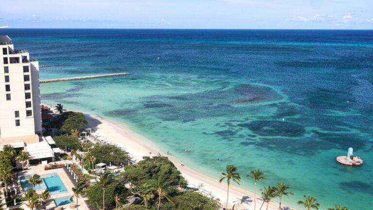 Aerial view of The Ritz-Carlton Aruba beside Palm Beach and turquoise Caribbean water