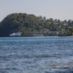 Round Hill Hotel and Villas spread across a green Jamaican hillside above the blue Caribbean Sea