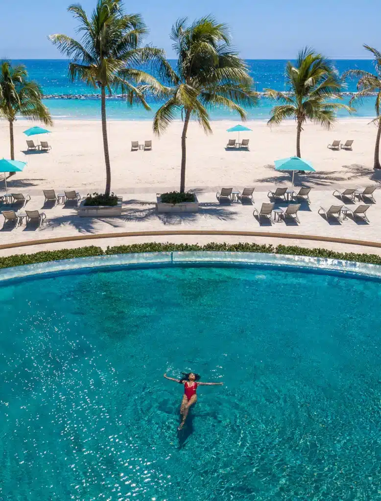 Sandals Barbados pool overlooking palm trees and the white sand of Dover Beach