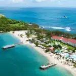 Aerial view of Sandals Grande St. Lucian on its peninsula with beach and Caribbean water