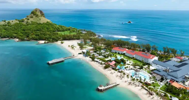 Aerial view of Sandals Grande St. Lucian on its peninsula with beach and Caribbean water