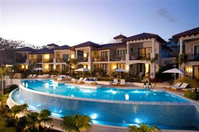 Sandals Grenada resort buildings and illuminated main pool in Grenada