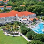 Aerial view of Sandals Ochi resort buildings, pools and tropical grounds in Ocho Rios, Jamaica
