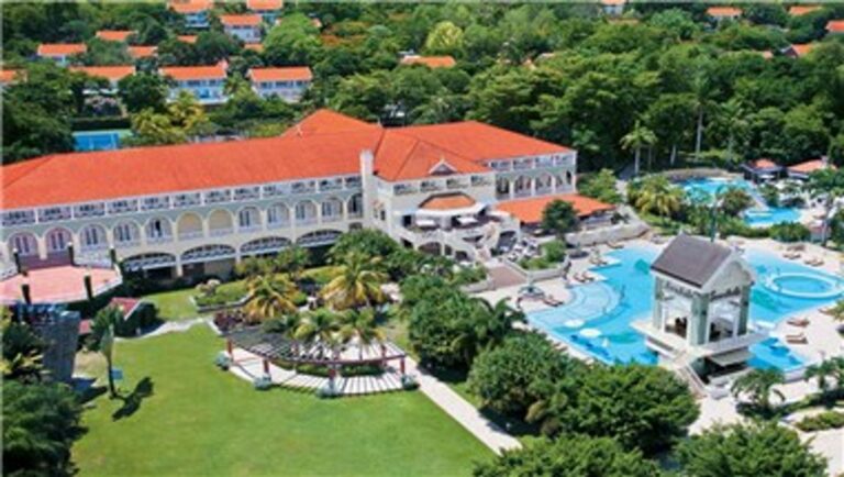 Aerial view of Sandals Ochi resort buildings, pools and tropical grounds in Ocho Rios, Jamaica