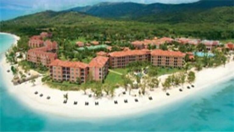 Aerial view of Sandals South Coast along a white-sand beach in Jamaica