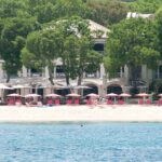 Sandy Lane resort beachfront with pink loungers, white sand and turquoise water in Barbados