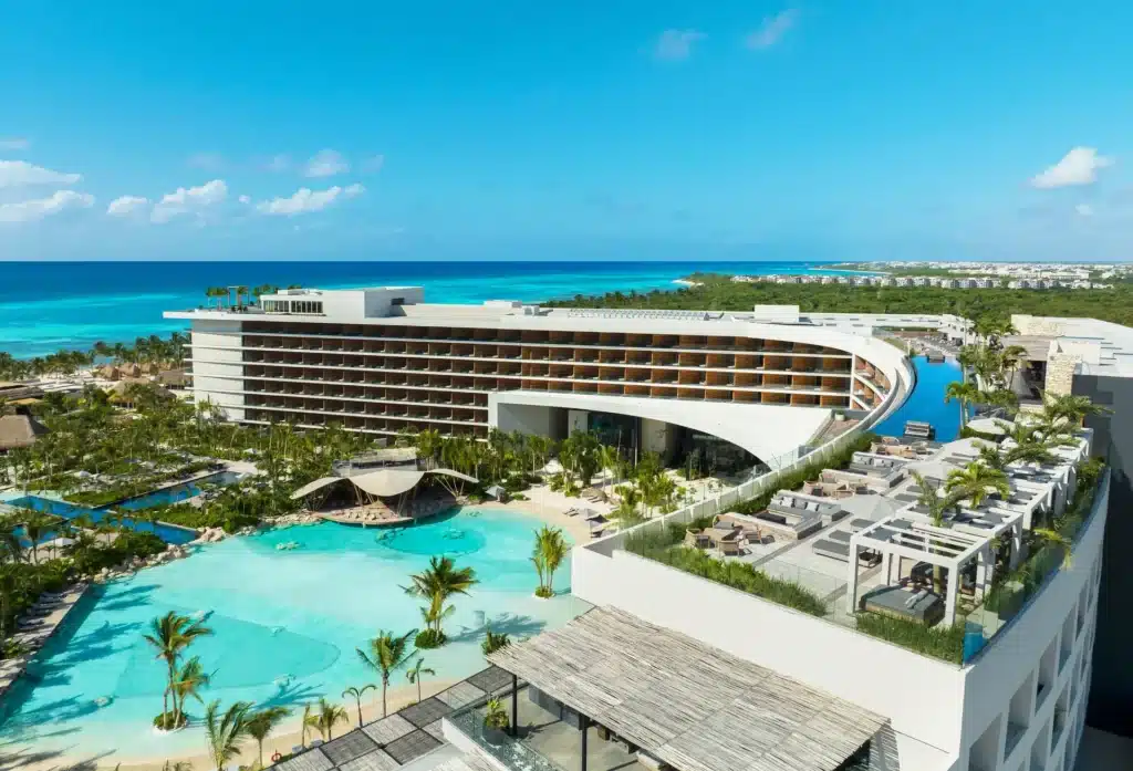 Aerial view of Secrets Moxché Playa del Carmen with lagoon-style pools and the Caribbean Sea