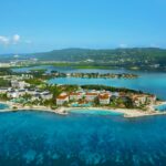 Aerial view of Secrets St. James Montego Bay on a tropical peninsula in Jamaica