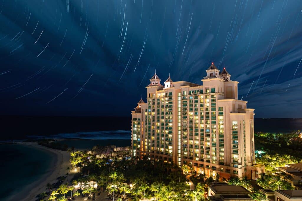 The Cove at Atlantis beachfront resort illuminated at night on Paradise Island, Bahamas