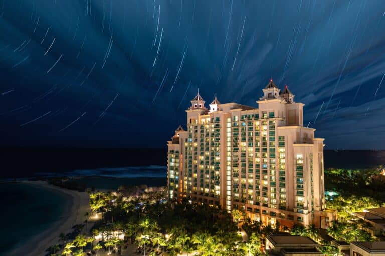 The Cove at Atlantis beachfront resort illuminated at night on Paradise Island, Bahamas