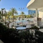 Pool area with the blue glass tower of Universal's Aventura Hotel in Orlando